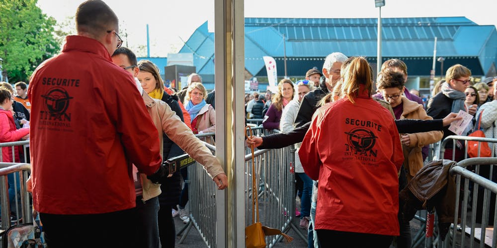 Security staff control festival goers at the 41th edition of "Le Printemps de Bourges" rock and pop music festival