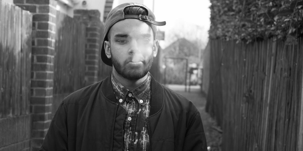 Man Blowing Smoke While Smoking