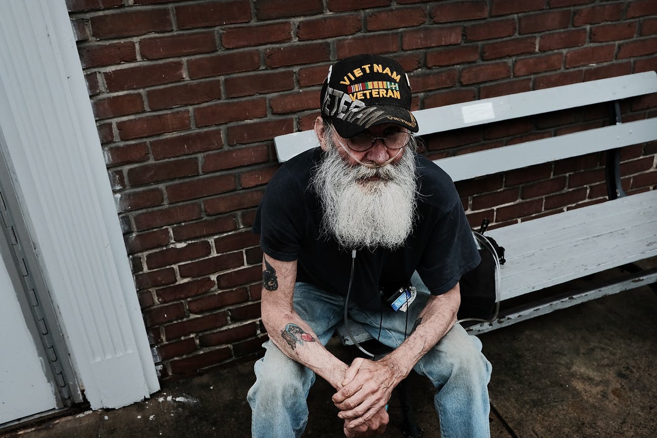 a Vietnam veteran, pauses downtown in the struggling city of Williamsport