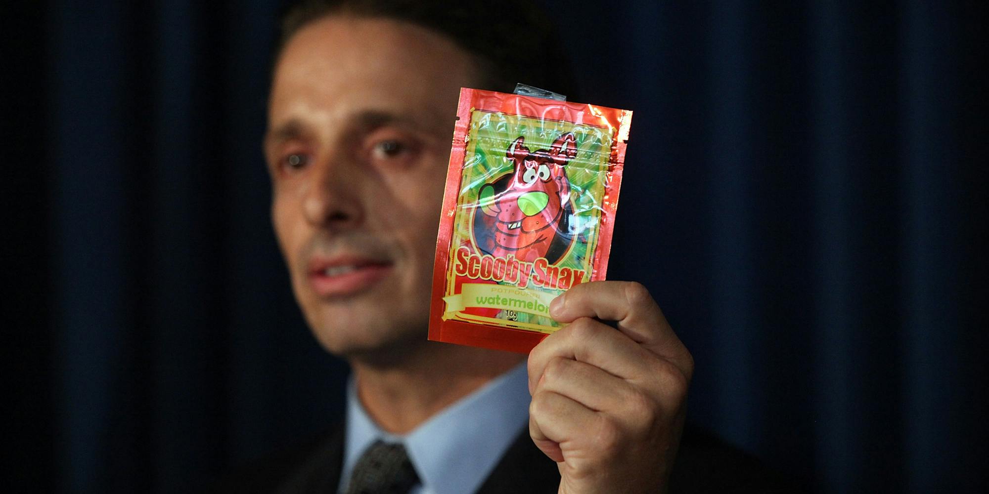 Kieth Kruskall with the Drug Enforcement Administration, holds up a package of synthetic marijuana