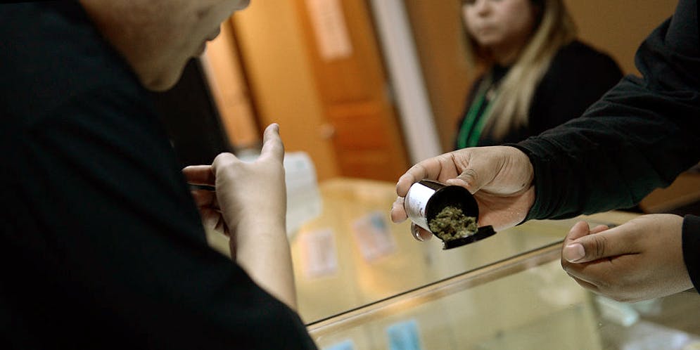 man buying cannabis