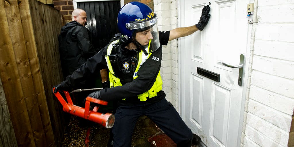 Police raiding a house