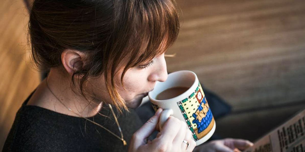 Women drinking a weed infused cup of coffee