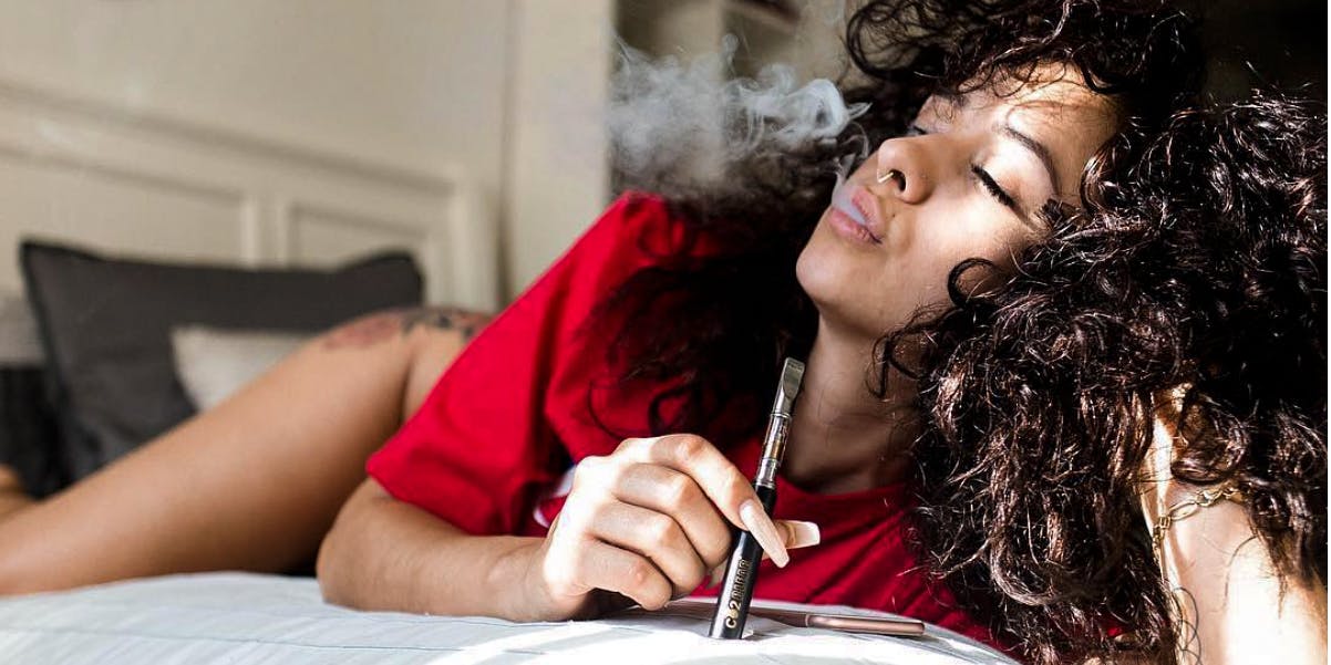 What is marijuana? You might think you know, but there's always more to learn. Here, a woman is shown smoking a vape