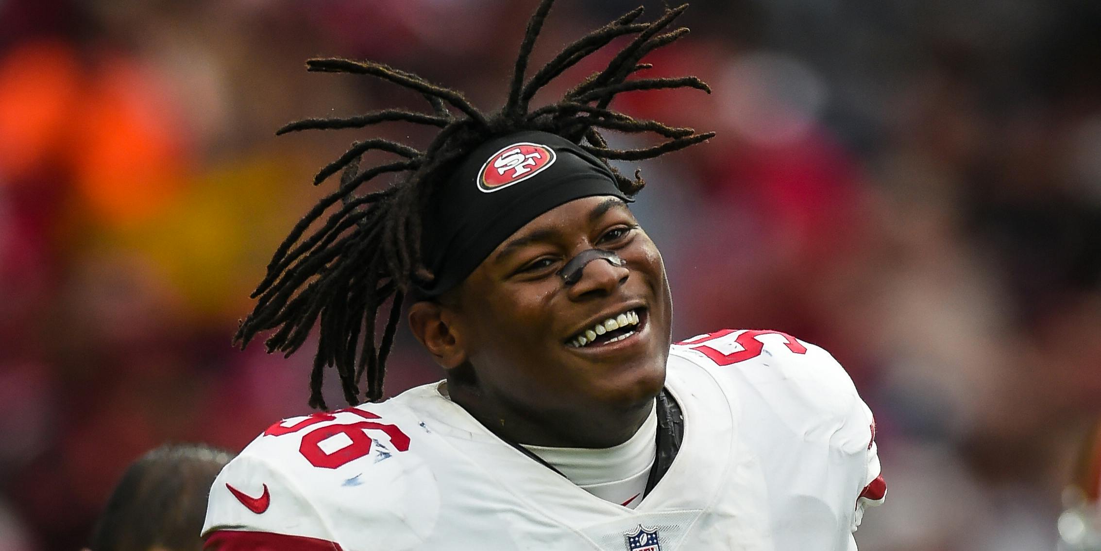 Reuben Foster of the San Fransisco 49ers smiling during a game