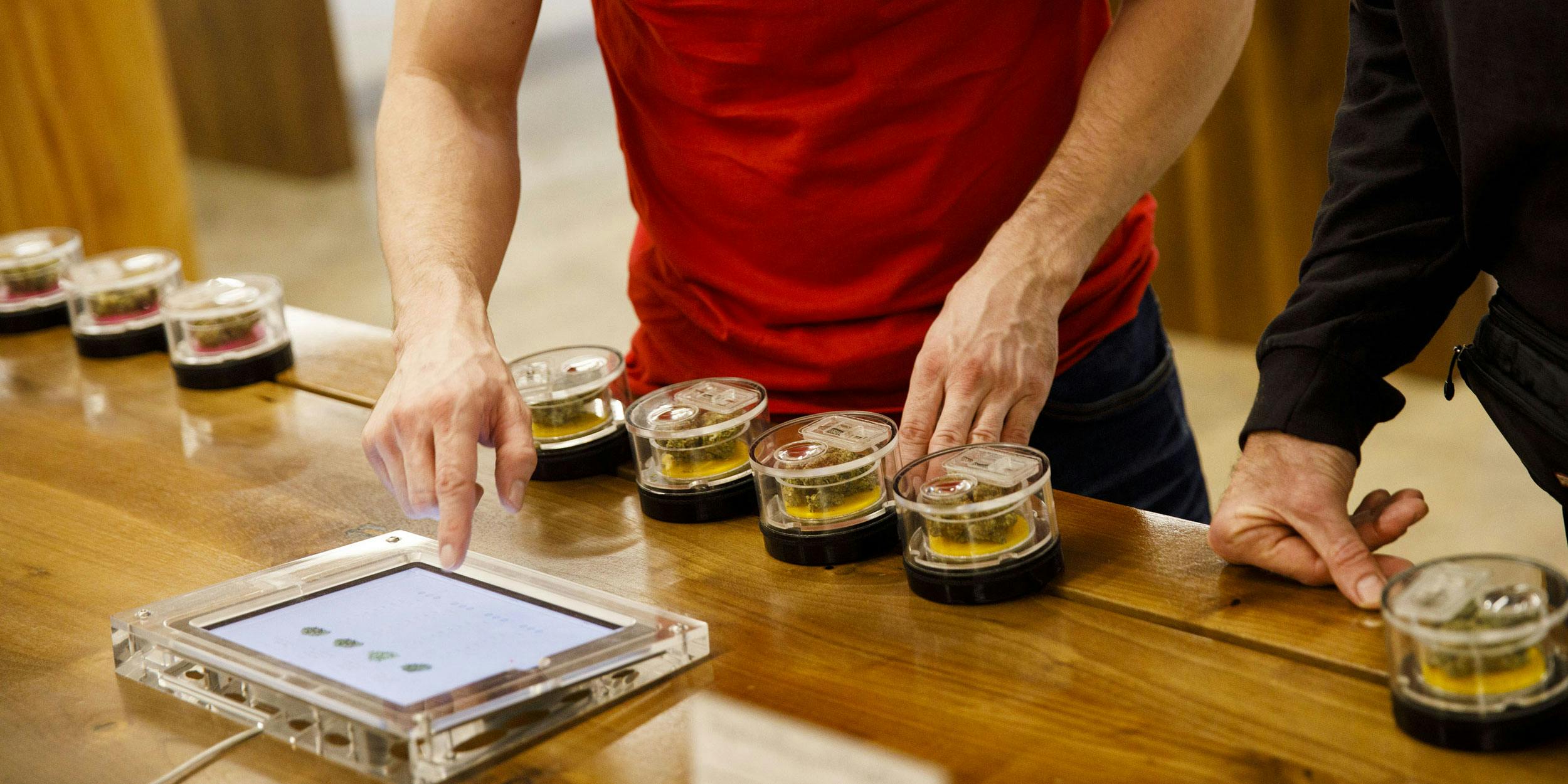 A man ordering marijuana at a cannabis dispensary