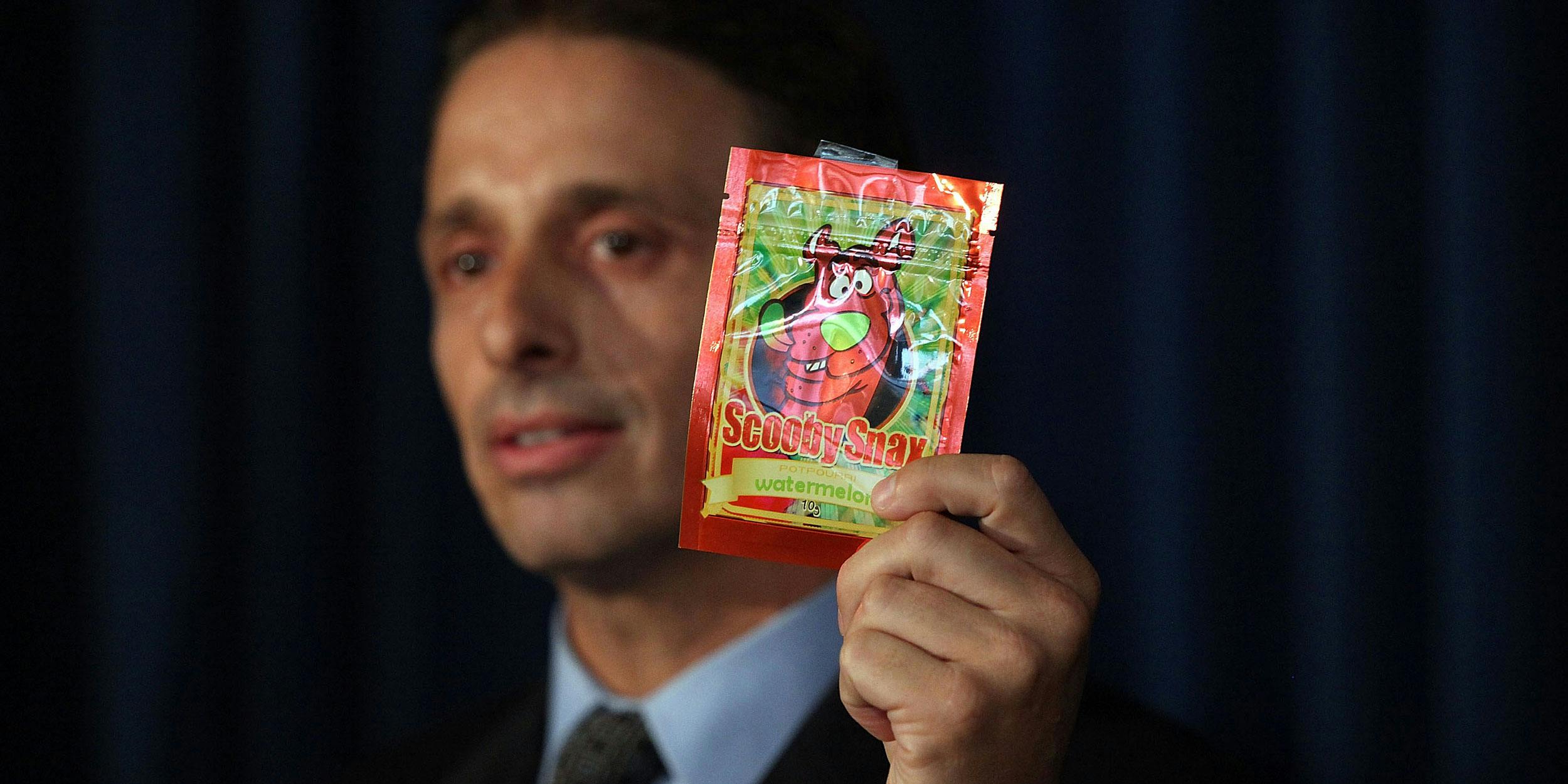 Kieth Kruskall with the Drug Enforcement Administration, holds up a package of synthetic cannabis