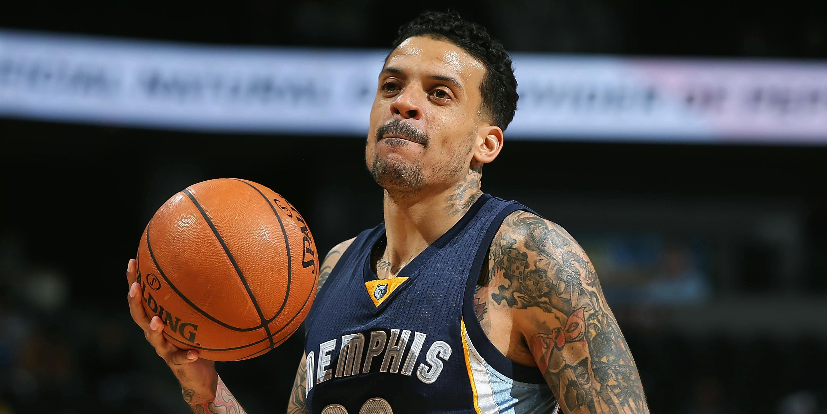 Matt Barnes holding a basketball and licking his lips while playing for the Grizzlies