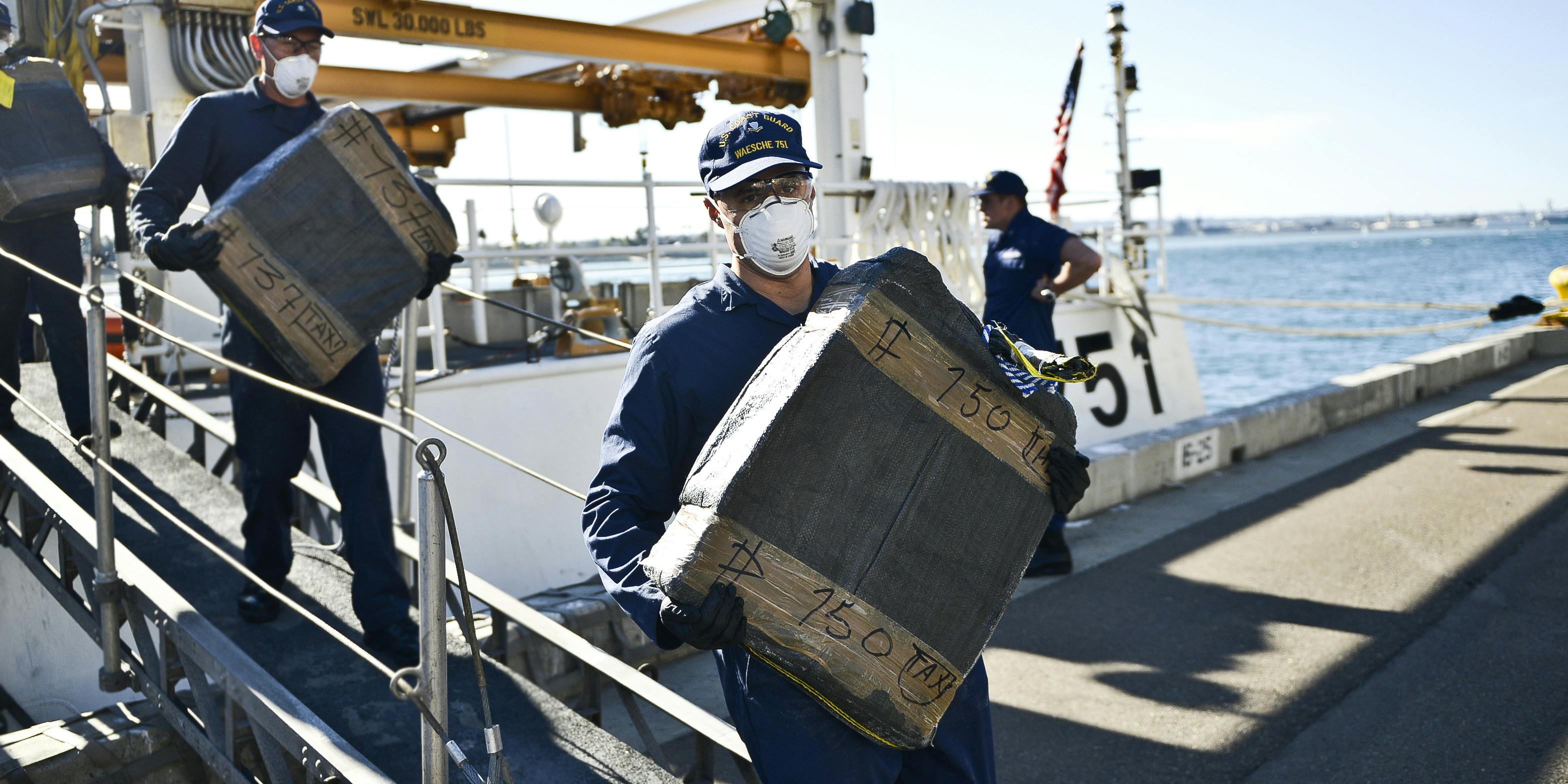 Crews from the U.S. Coast Guard Cutter Waesche offload nearly 660 kilograms of narcotics in 2015. Nearly 500 pounds of cannabis, $6000, and a gun were recently seized during the arrest of two individuals trying to illegally cross the border off Florida's coastline.