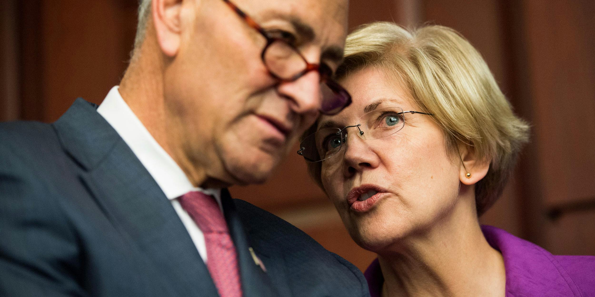From left, Sen. Chuck Schumer, D-N.Y., and Sen. Elizabeth Warren, D-Mass., talk during the Senate Democrats' news conference on Tuesday, July 21, 2015. They've both been crucial to the marijuana legalization movement.