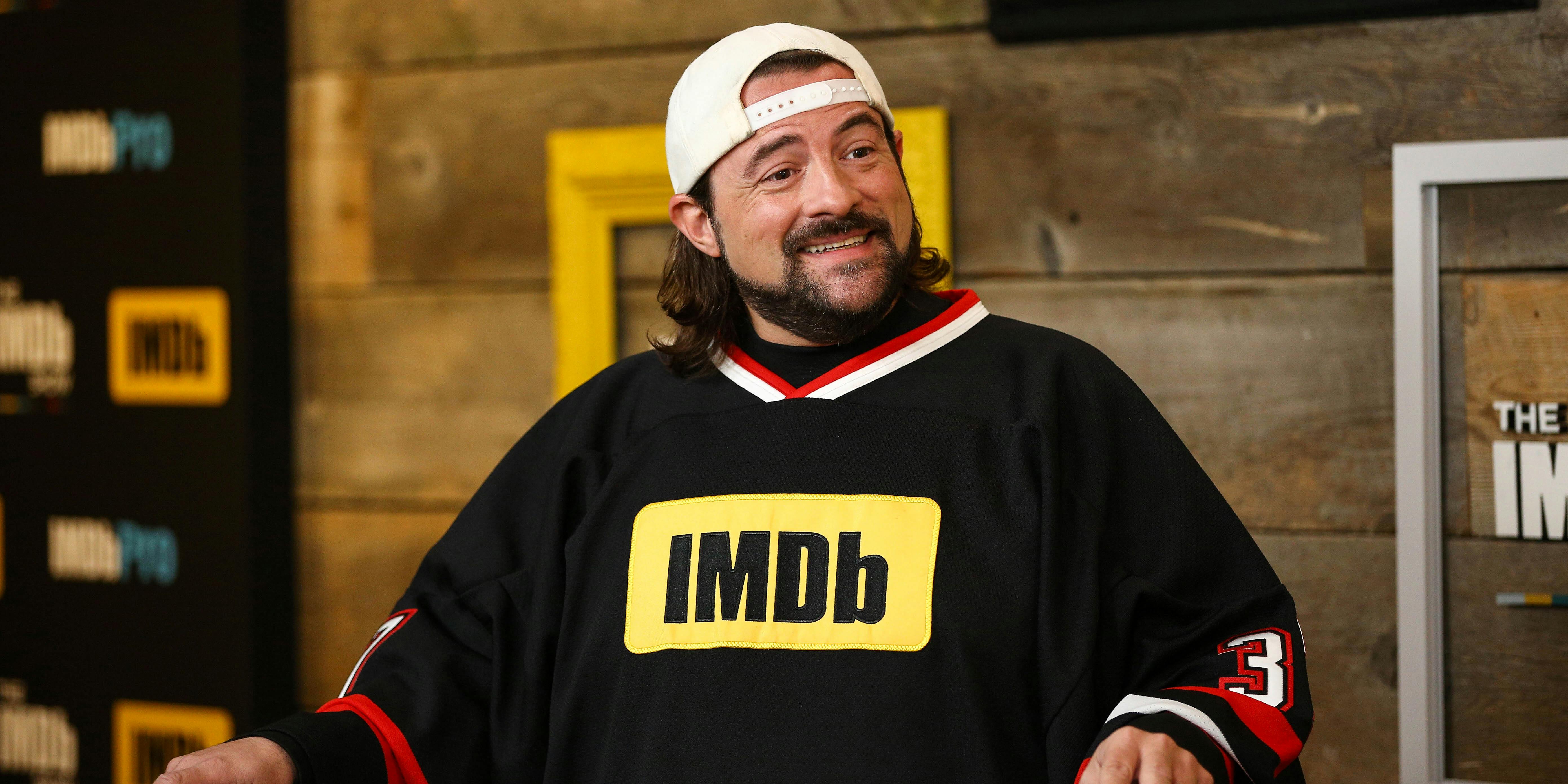 Kevin Smith wears an IMDb shirt during an interview. He is crowdfunding for his next comedy series 'Hollyweed'