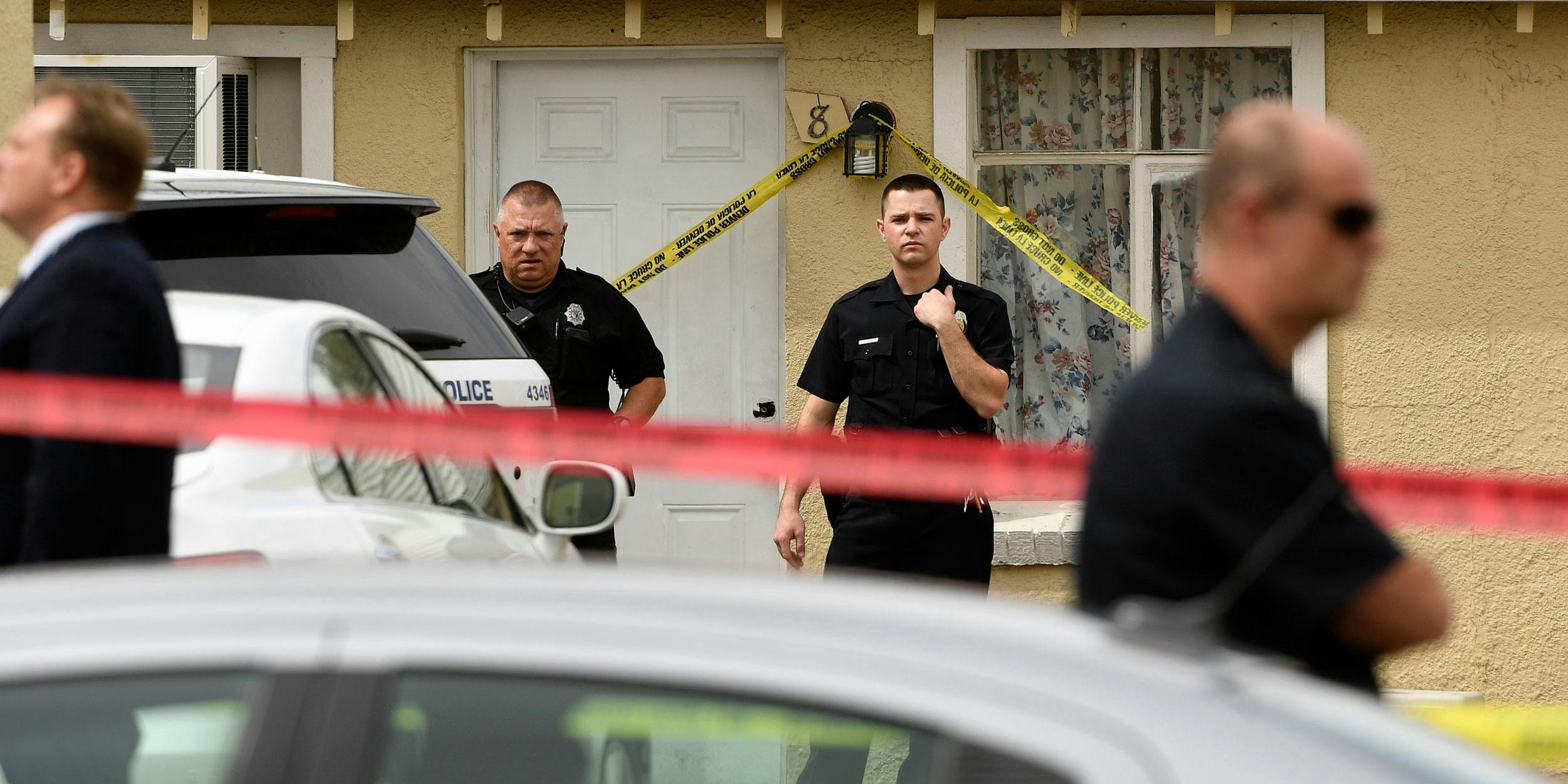 Officers guard a motel at the scene of a shooting in 2016. A new study suggests that police are solving more serious crimes, like this one, in Colorado and Washington since cannabis legalization.