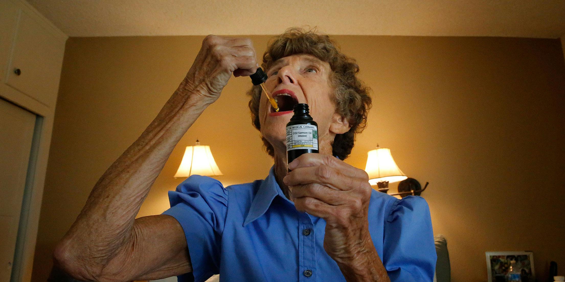 A senior takes a drop of medical marijuana under her tongue to help with pain relief. A recent Northwell survey found that 27 percent of seniors were able to forgo other forms of pain medication after using cannabis.
