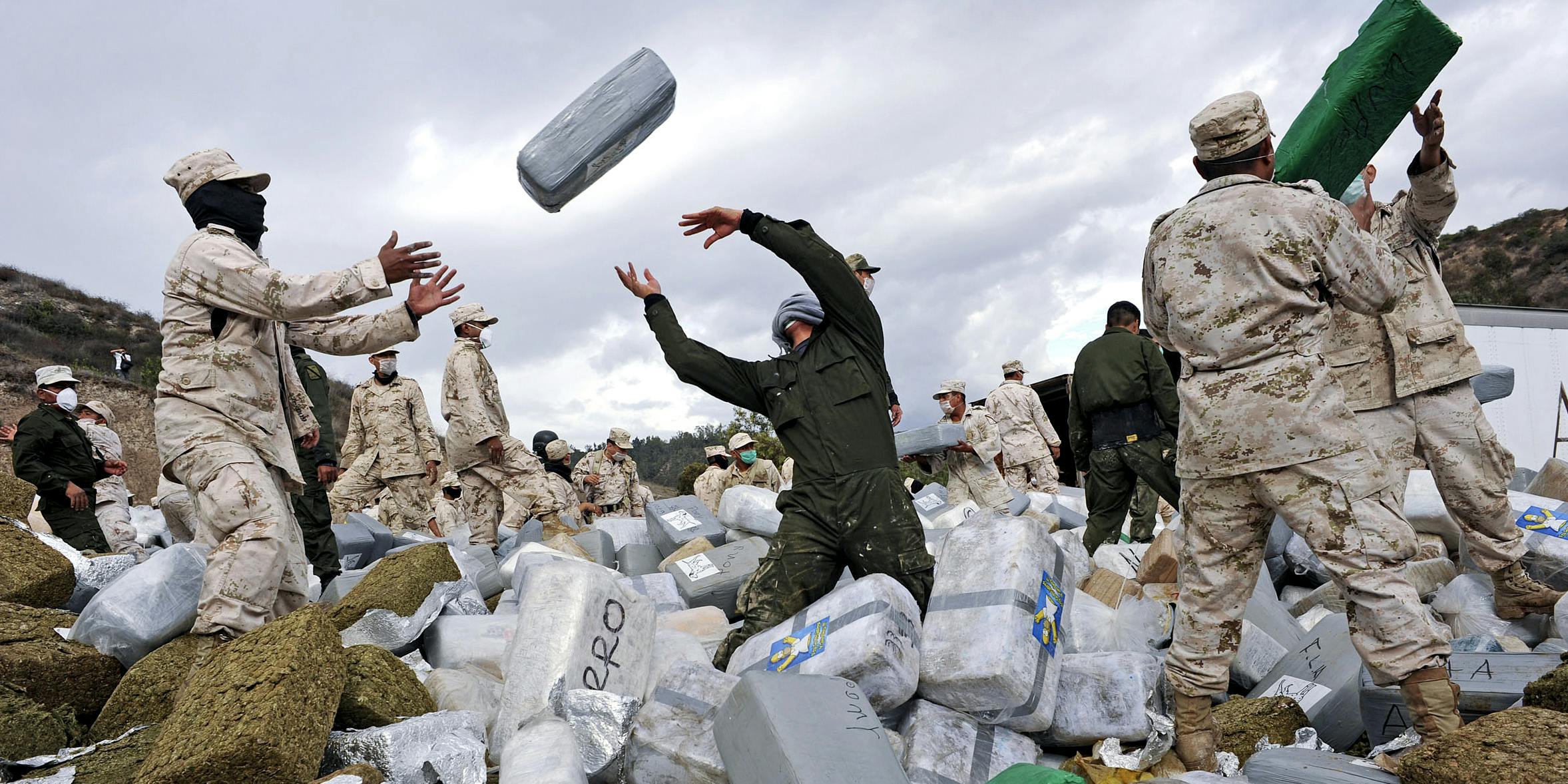 Mexican soldiers unload bundles of seized marijuana before incinerating the drugs at a military base in Tijuana, Mexico, on Wednesday, Oct. 20, 2010. Authorities carried out the biggest marijuana bust in Mexico's history this week when approximately 134 tons of marijuana headed for the U.S. was confiscated by soldiers and police. Mexico has impounded more than 7,400 tons of marijuana this year as part of President Felipe Calderon's fight against drug cartels.