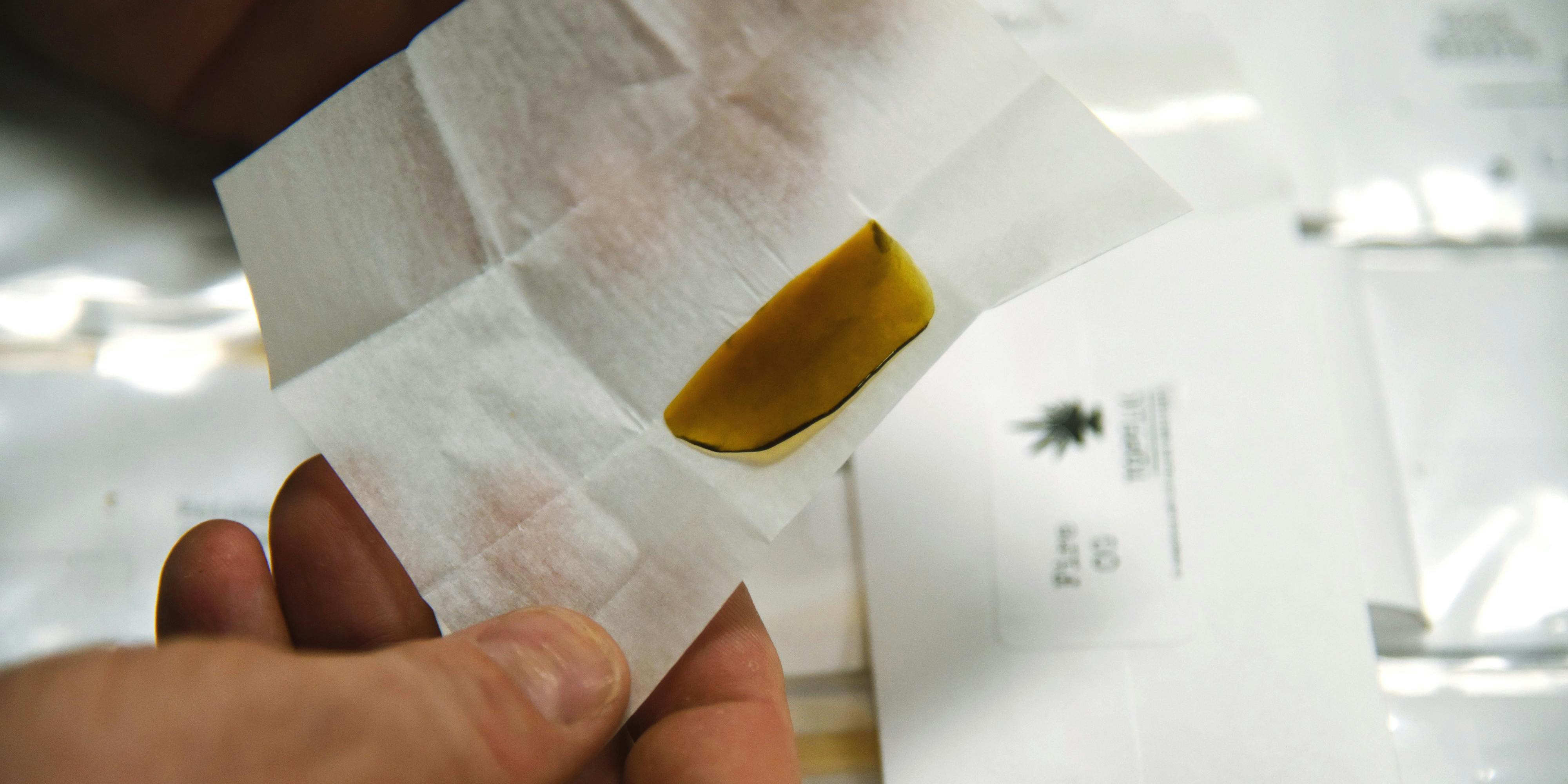 A budtender displays marijuana "wax," a concentrated form of marijuana. Concentrates are a popular way to consume cannabis. The respected Dr. Rav Iker recently expressed his belief that Cannabis concentrates are only good for "getting really high"