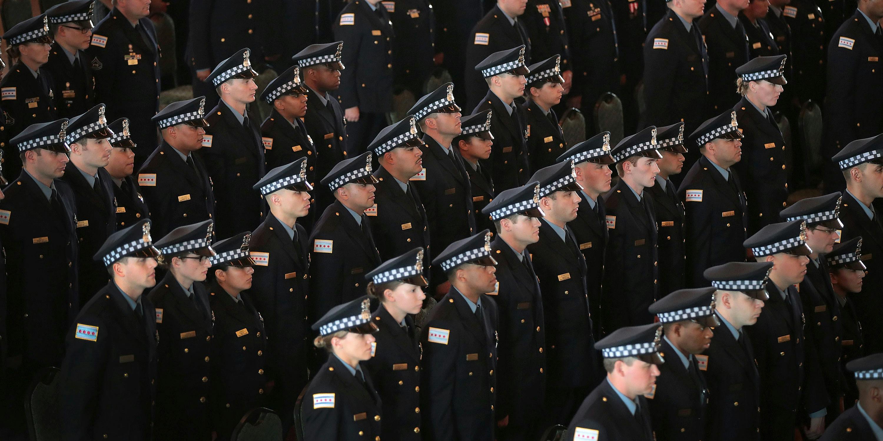 Chicago police officers attend a graduation and promotion ceremony in the Grand Ballroom on Navy Pier on June 15, 2017 in Chicago, Illinois. (Photo by Scott Olson/Getty Images)
