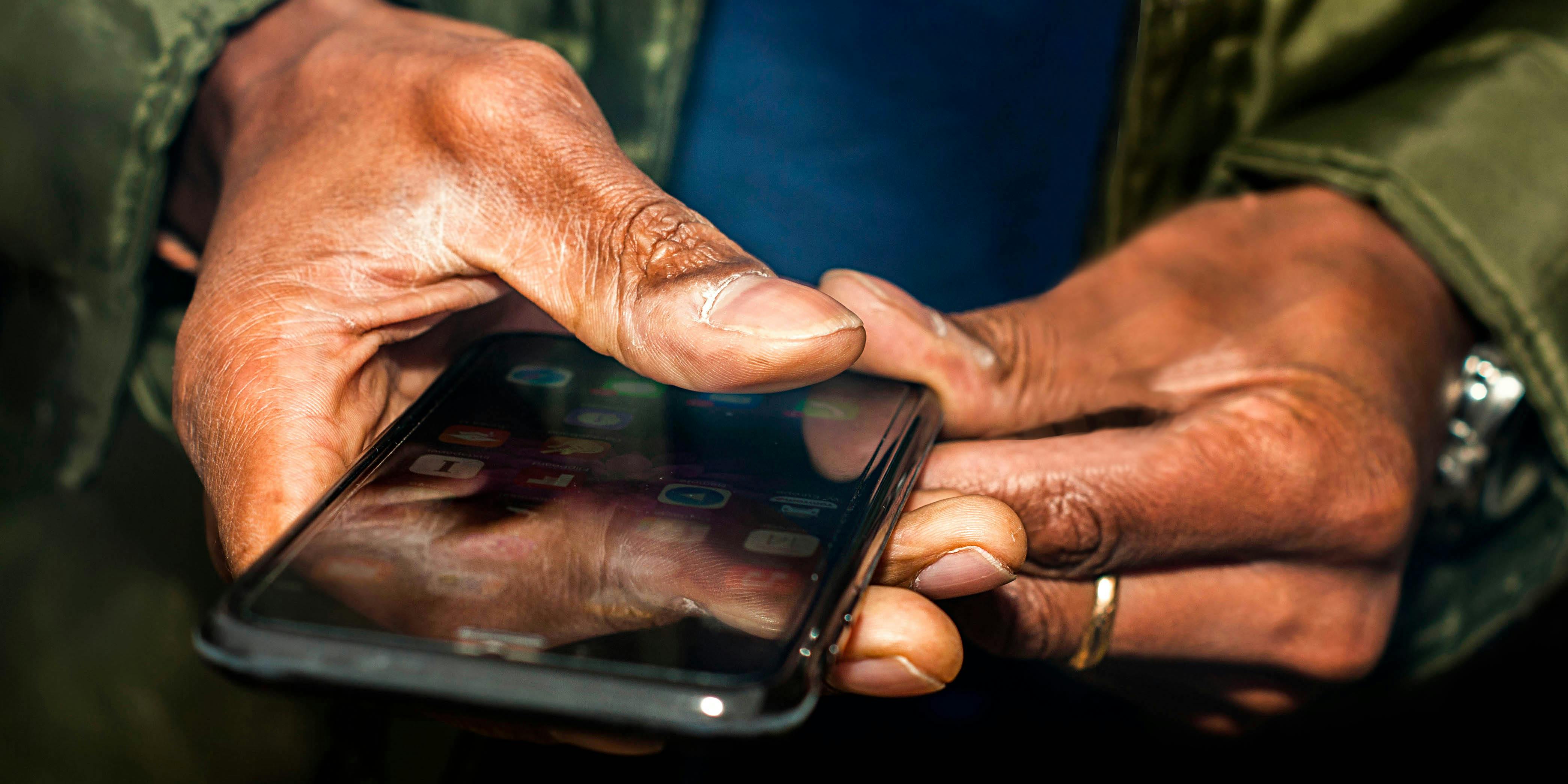 A person plays mobile weed game Hempire, who hope to educate about cannabis, community, and culture