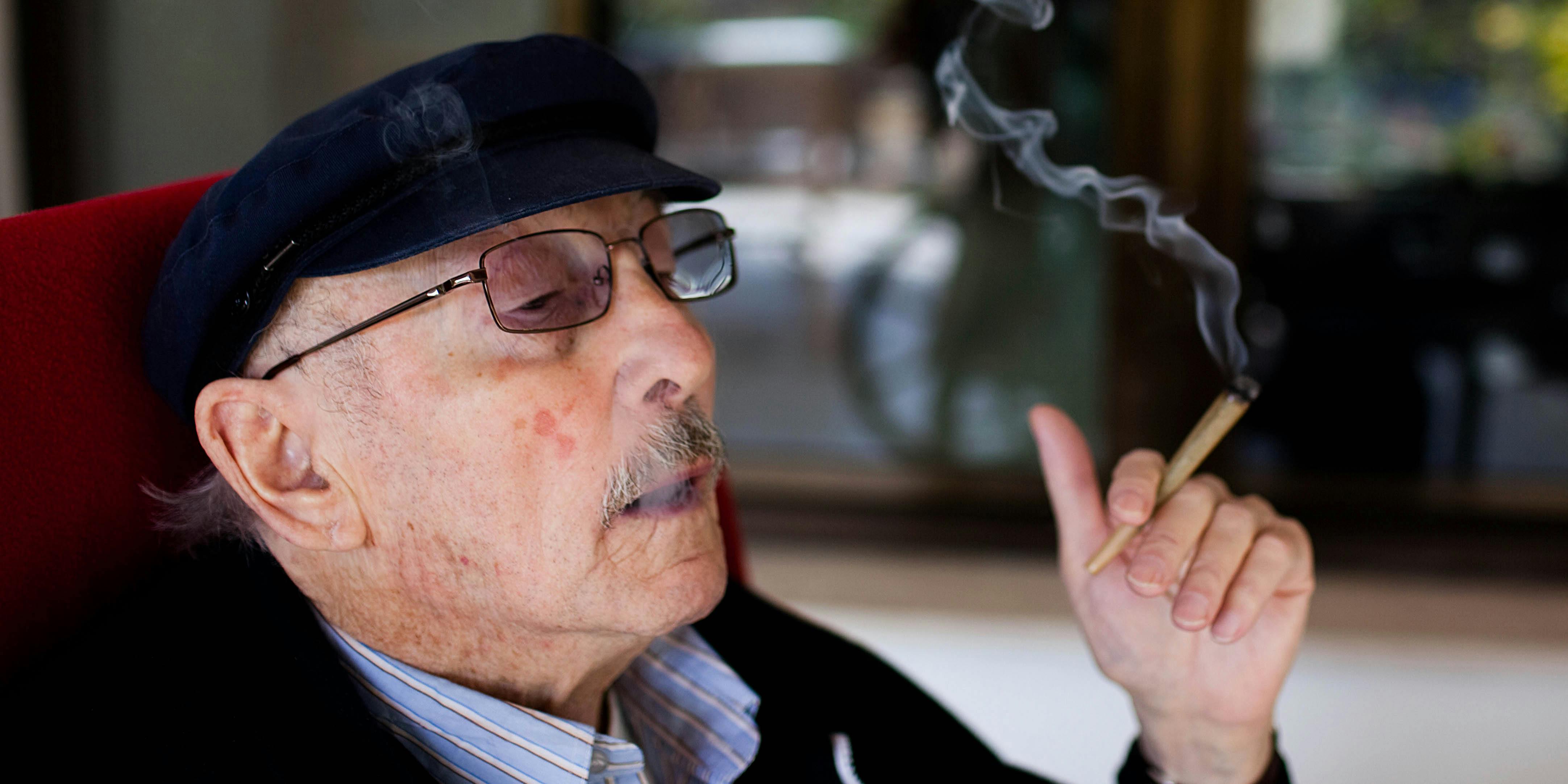A man smokes cannabis at a nursing home in Israel. Most pain specialists are prescribing cannabis to patients to deal with pain.