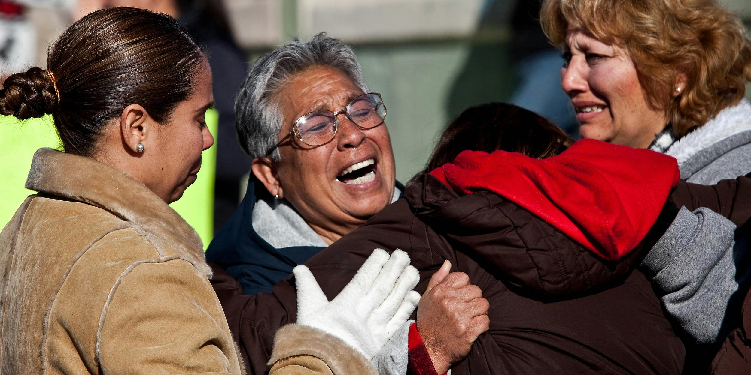 Relatives of Jaime Irigoyen Flores, a 19-year-old baseball player and law student, break down after they find out their son was found dead. Flores was reportedly grabbed by the military from his home and found executed the next morning. (Photo by Richard Ellis)