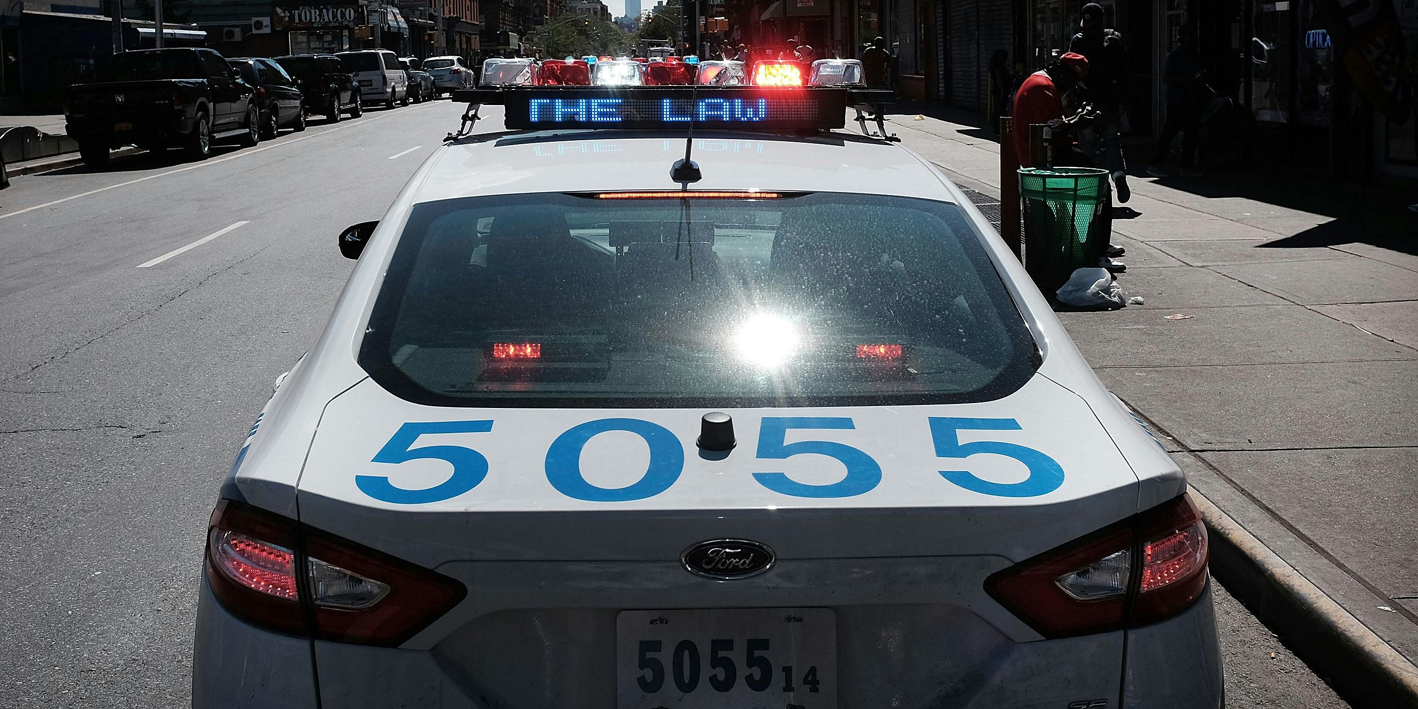 NEW YORK, NY - AUGUST 28: An NYPD squad car is viewed in an area where people smoke K2 or 'Spice', a synthetic marijuana drug in East Harlem on August 28, 2015 in New York City.