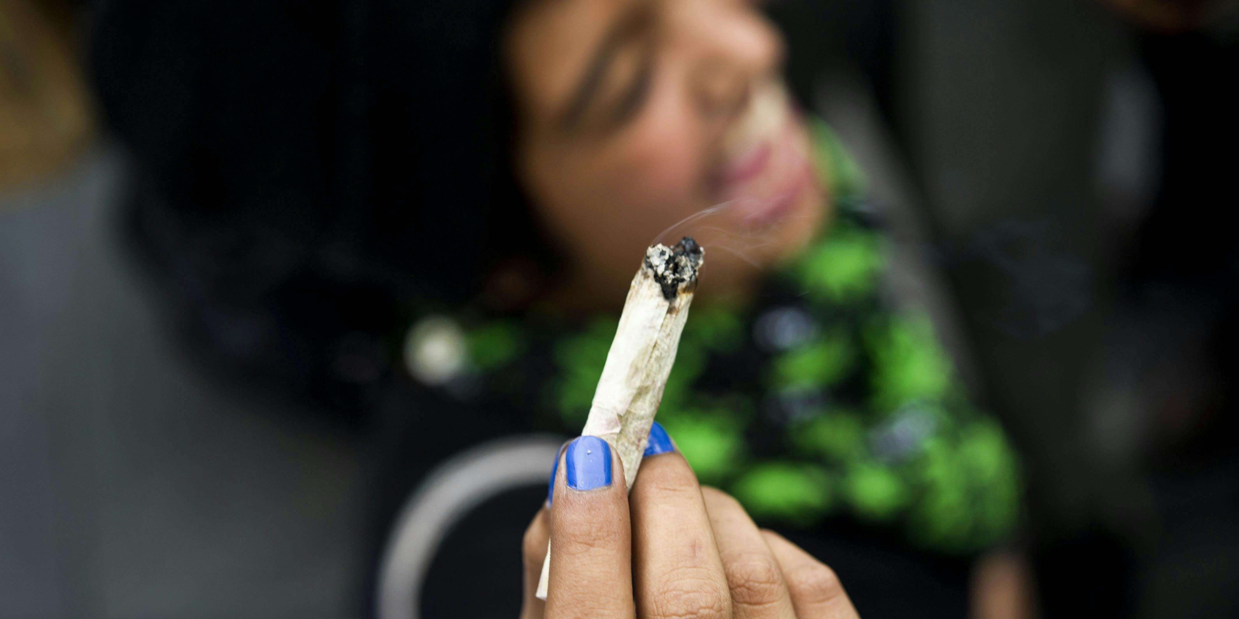 Two physicians in New Jersey want to open what they're calling the disneyland of marijuana. Here, a woman is shown smoking a joint and smiling