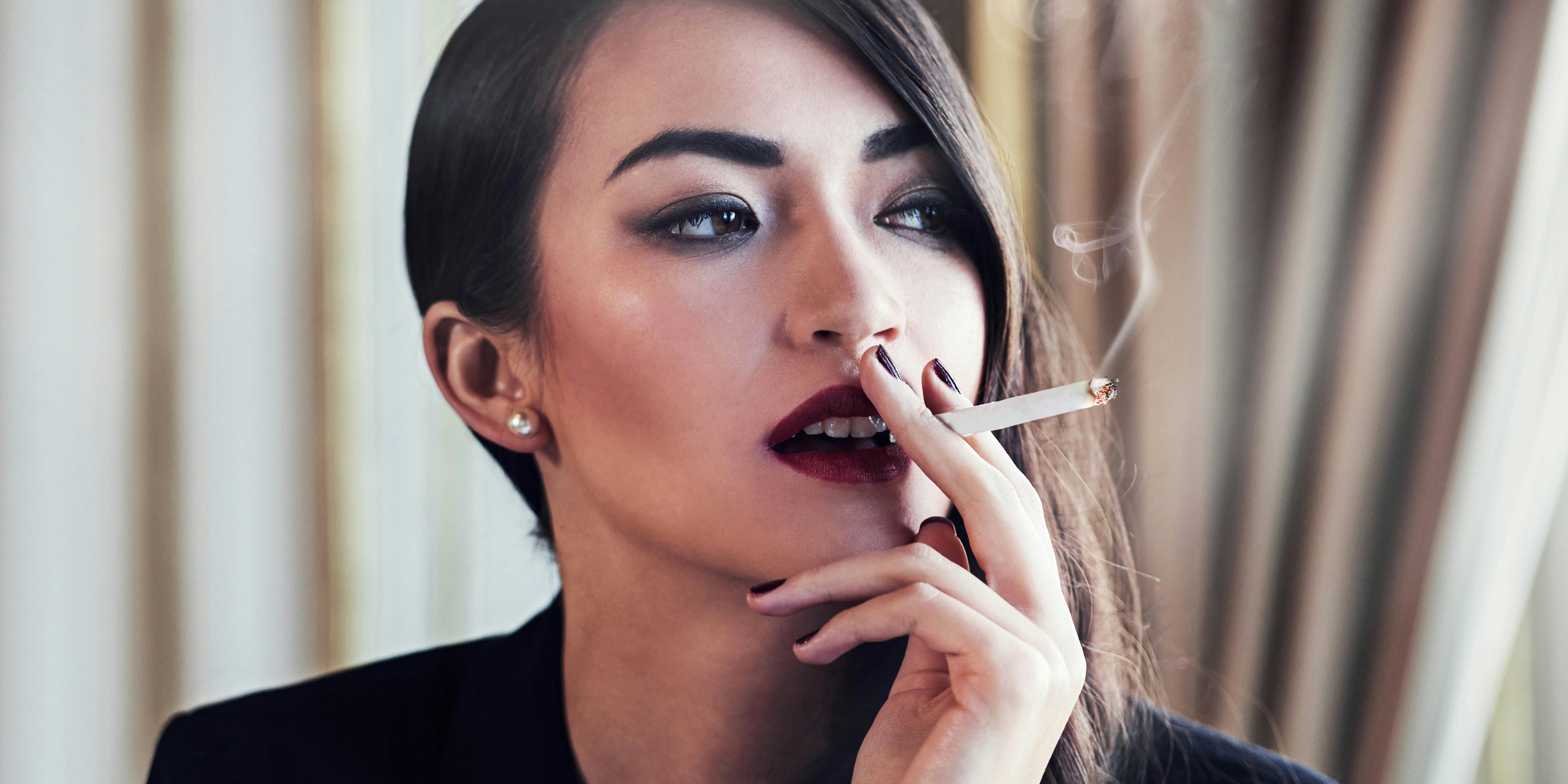 The Marijuana Show, aka the Shark Tank of Marijuana, is looking for the next weed millionaire. Here, we see a woman smoking a joint.