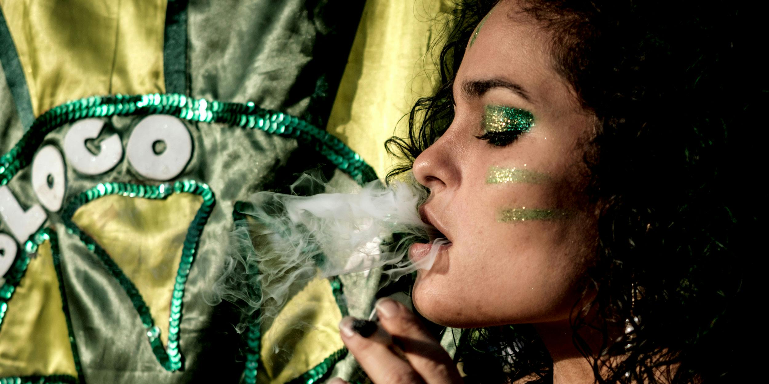 A woman smokes a joint during a march calling for the legalization of marijuana along Ipanema beach in Rio de Janeiro, Brazil on May 6, 2017. Weed slang for a joint in Brazil is a beck, in case you’re looking for a single-serve in the country.