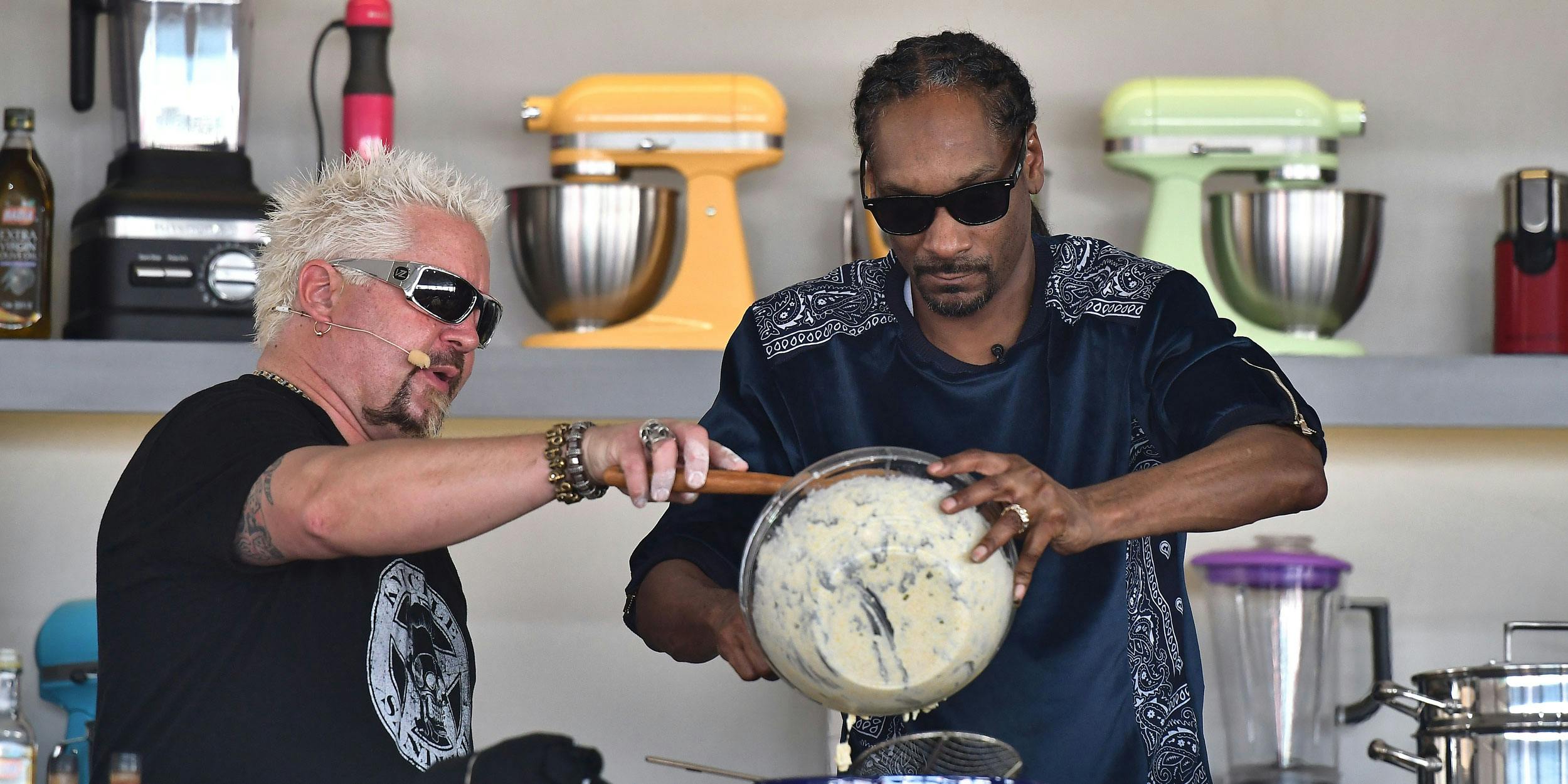 MIAMI BEACH, FL - FEBRUARY 25: Guy Fieri and Snoop Dogg cook on stage at Goya Foods' Grand Tasting Village on February 25, 2017 in Miami Beach, Florida. Snoop Dogg’s cookbook will be available in stores on October 23. (Photo by Gustavo Caballero/Getty Images for SOBEWFF)