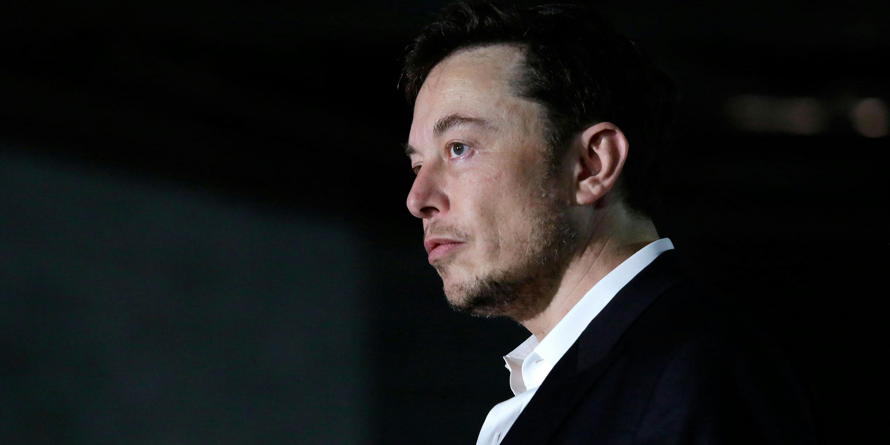Engineer and tech entrepreneur Elon Musk of The Boring Company listens as Chicago Mayor Rahm Emanuel talks about constructing a high speed transit tunnel at Block 37 during a news conference on June 14, 2018 in Chicago, Illinois. Rumors surfaced last month that Elon Musk smokes weed, sparking concern among investors. After the rumors were confirmed on Friday, Tesla’s stock plummeted. (Photo by Joshua Lott/Getty Images)