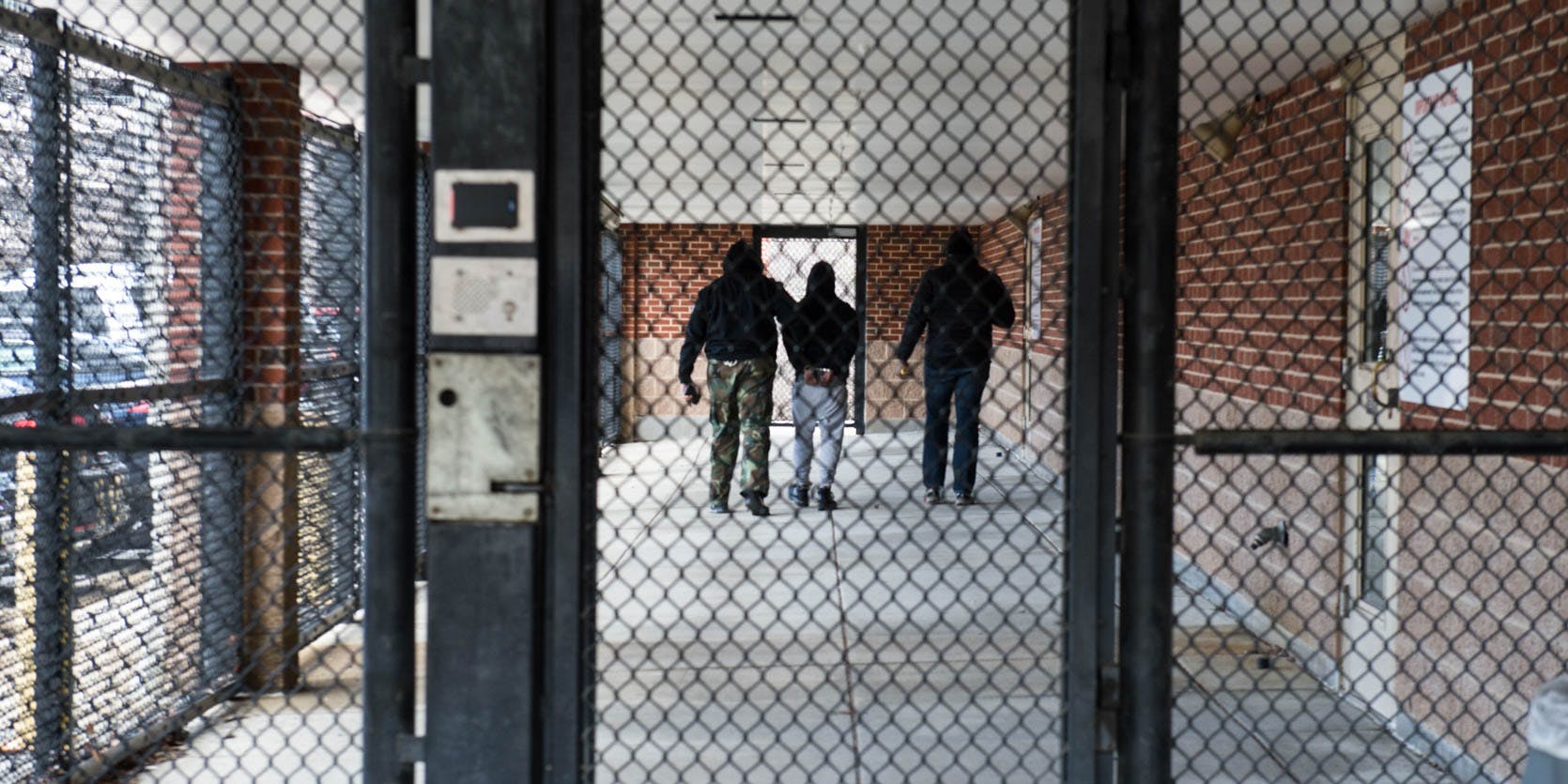 An inmate is escorted down the prison hallway. synthetic marijuana deaths in prison.