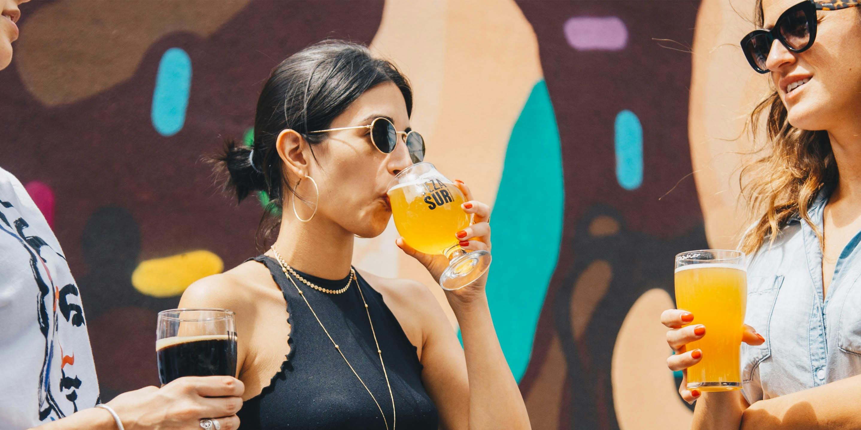 The Top 5 Cannabis Strains for Hangover Symptoms. Here, women are shown drinking beer