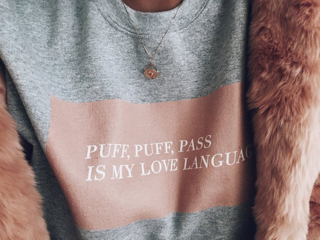 Weed Fashion That Says ‘I Love Cannabis, But I’m Tasteful About It.' Here, the puff puff pass sweatshirt is shown