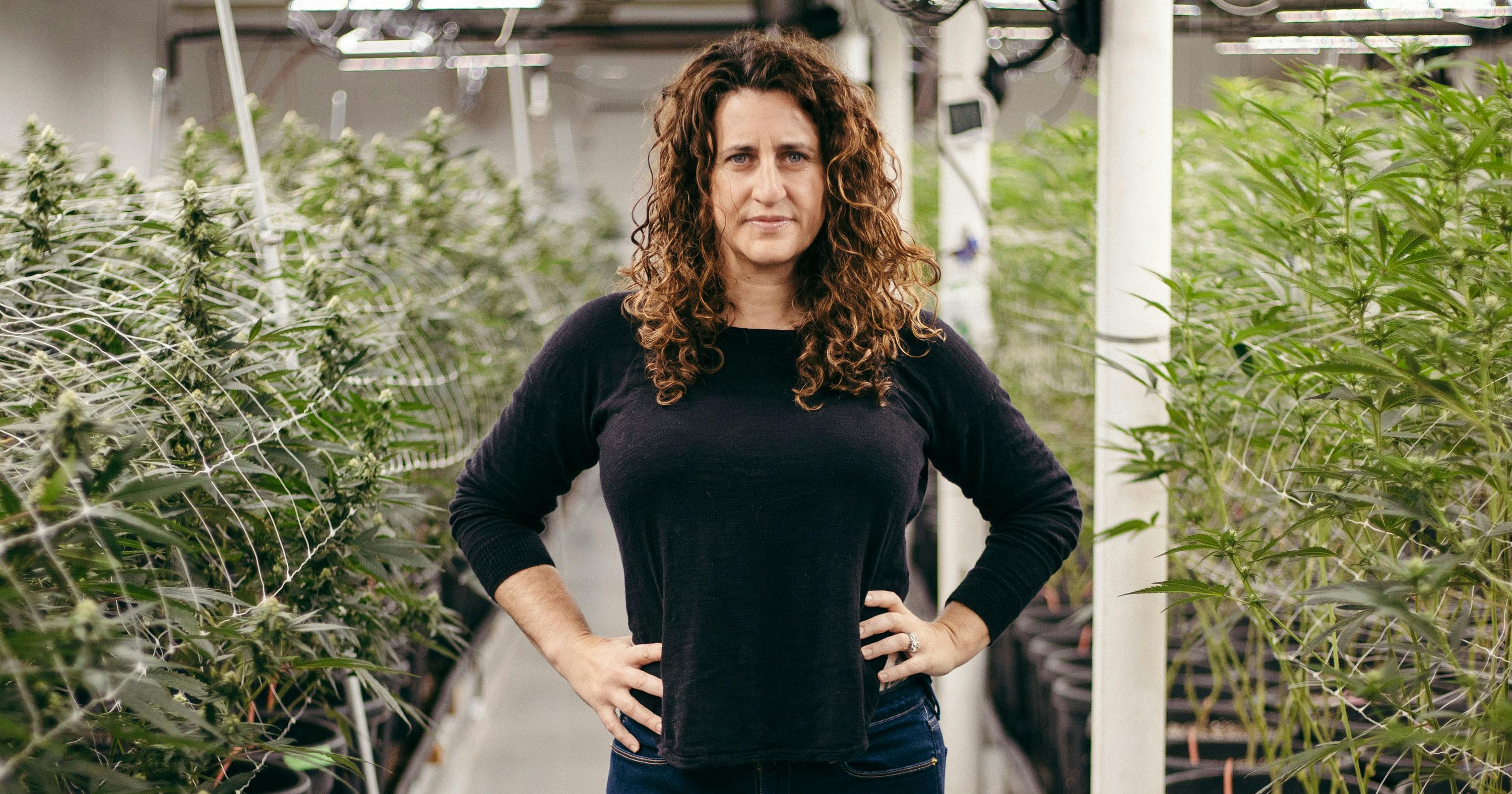 Amy Margolis stands in an indoor cannabis grow