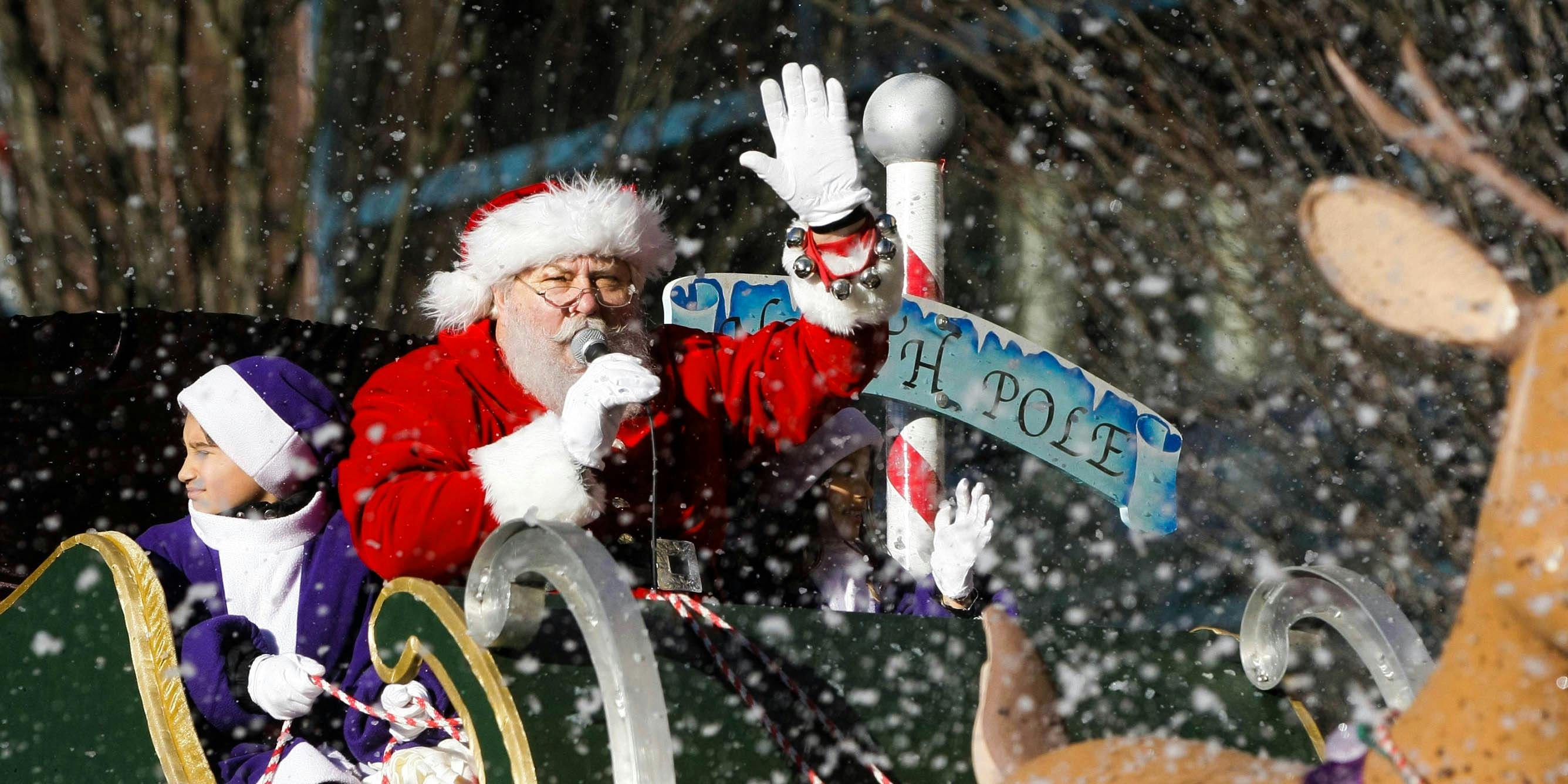 Santa Claus waves at the crowd from his float during the annual Vancouver Santa Claus Parade.