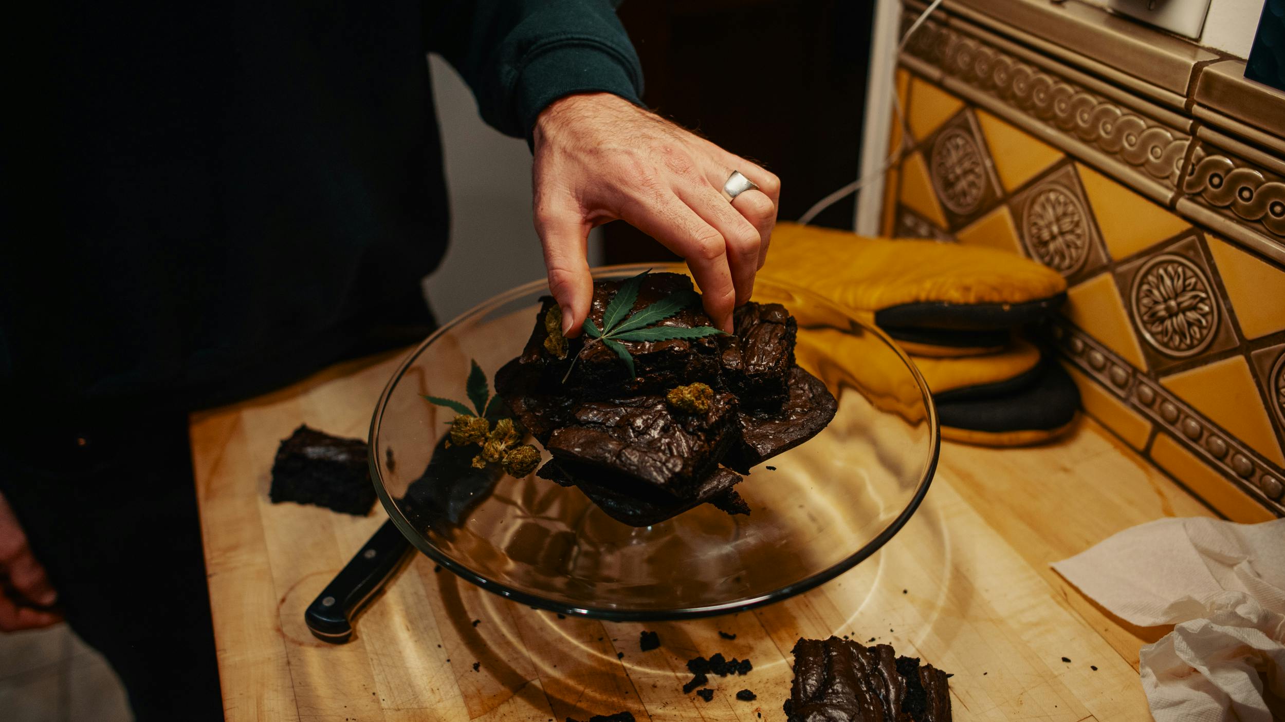 Hands mixing up a batch of the best weed brownies