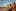 Two people sit on a beach enjoying some of the best CBD drinks