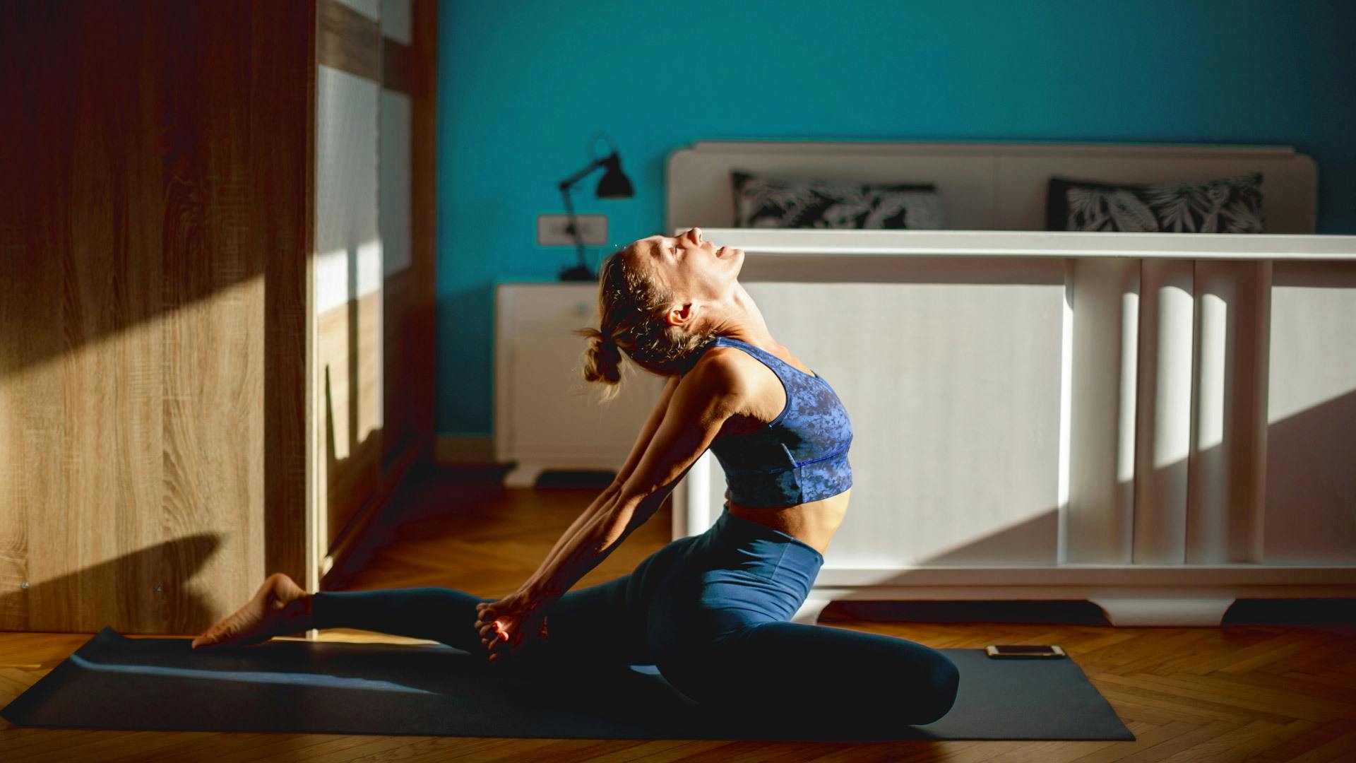 woman in pigeon pose at home 1296x728 header Cannabis Tolerance Break: How & When To Take It